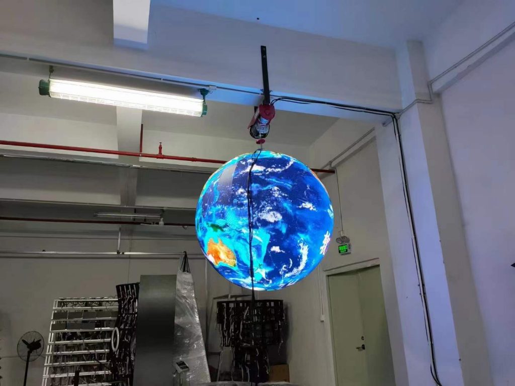 Led spherical screen suspended from the factory ceiling
