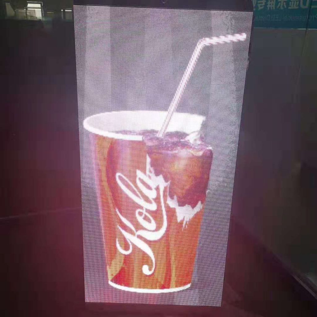 The lamp-post display shows a glass of coke