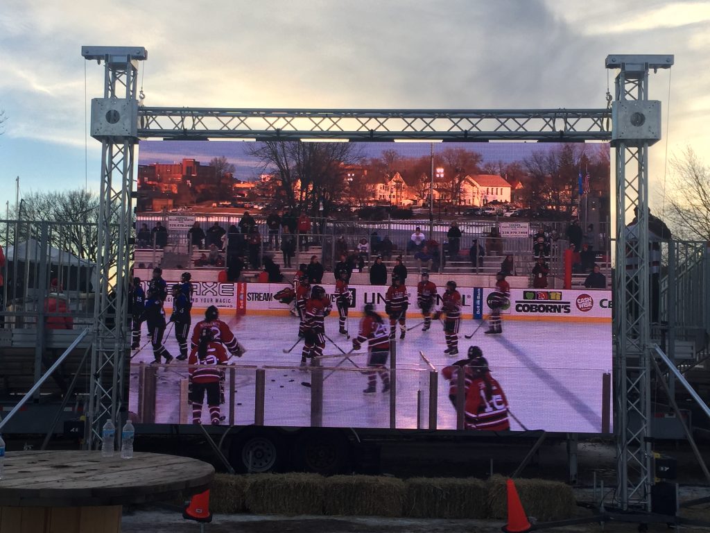 The outdoor rental screen is showing the hockey game