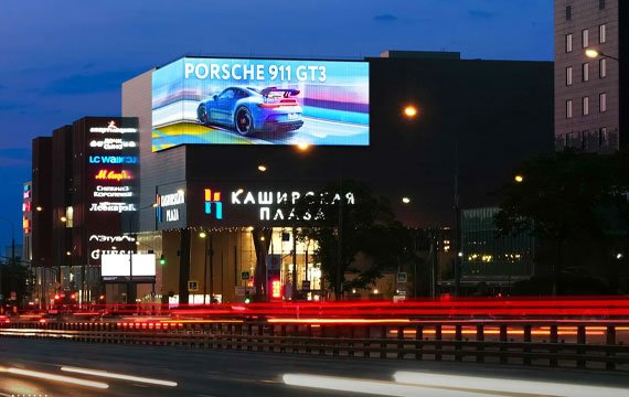 Outdoor P8 LED displays are installed on the building to display advertisements for cars