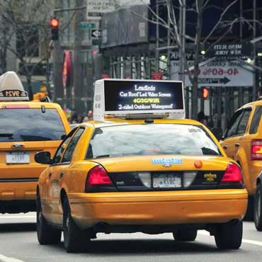 A Taxi Roof LED Display Displays The Message