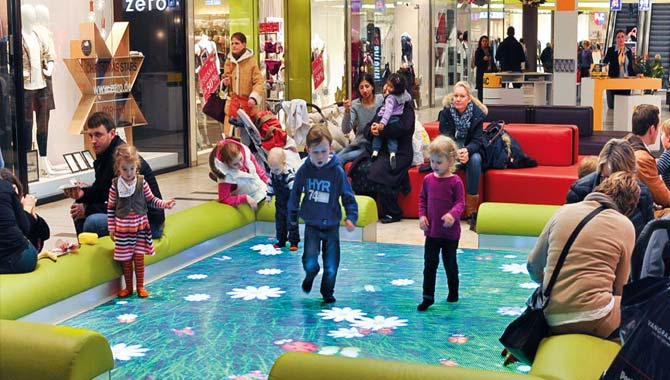 Children In A Mall Play On An Interactive Floor Tile LED Display